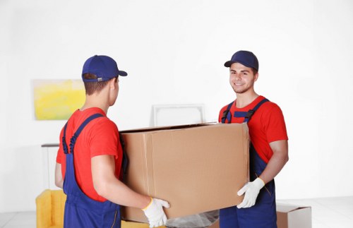 Removal van and moving boxes outside a Watford home