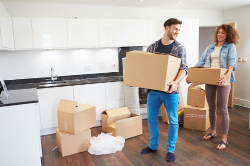 Loading household items into a removals van in Watford