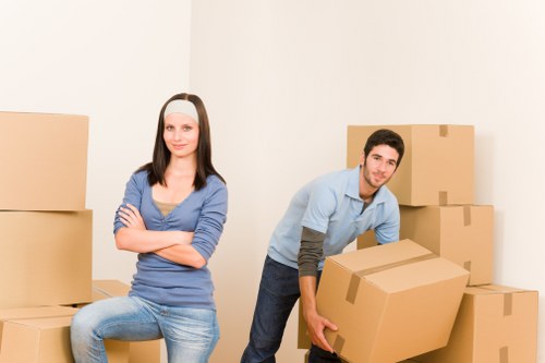 Local removal team handling boxes and furniture in Watford