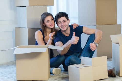 A removals crew handling furniture carefully during a Watford move