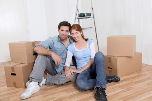 Local removals team planning a house move in Watford residential street