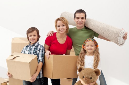 Careful unloading of boxes and furniture at a Watford property