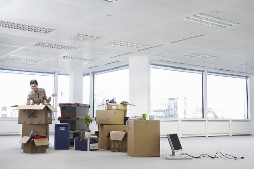 A removals van handling furniture and boxes for a move in Watford